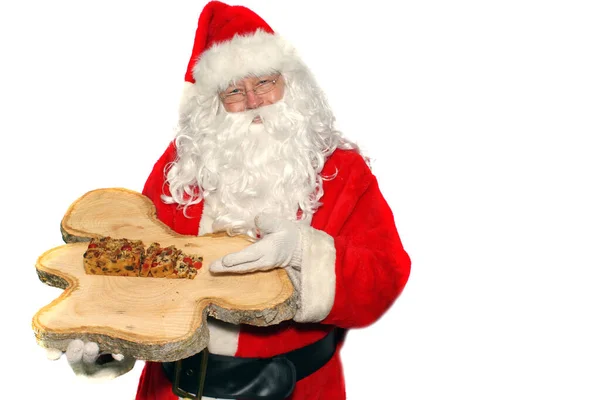 Weihnachtsmann Mit Torte Auf Holzbrett — Stockfoto