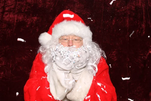 Santa Claus Santa Claus Blows Shredded Paper His Hands Photo — ストック写真