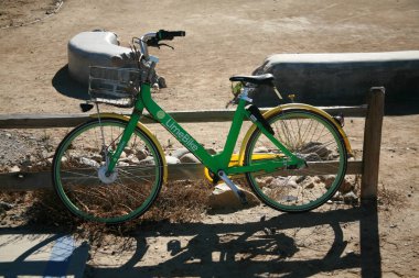 San Ysidro, California - 11/26/2018: A LIMEBIKE sits next to a fence in a San Ysidro park outside close to the US Mexico border. 