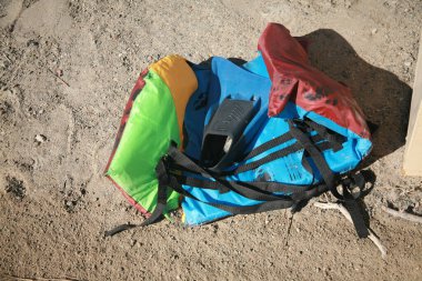 San Ysidro, California - 11/26/2018: Discarded Life Vest and Flipper on the ground. Suspected flotation device from an Mexican national illegally entering the united states.