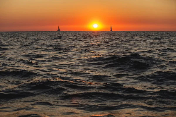 Sunset in an open black sea — Stock Photo, Image