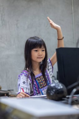 Thai girls study online at home to prevent the spread of COVID-19