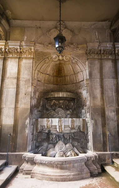 Fountain in a wall niche — Stock Photo, Image