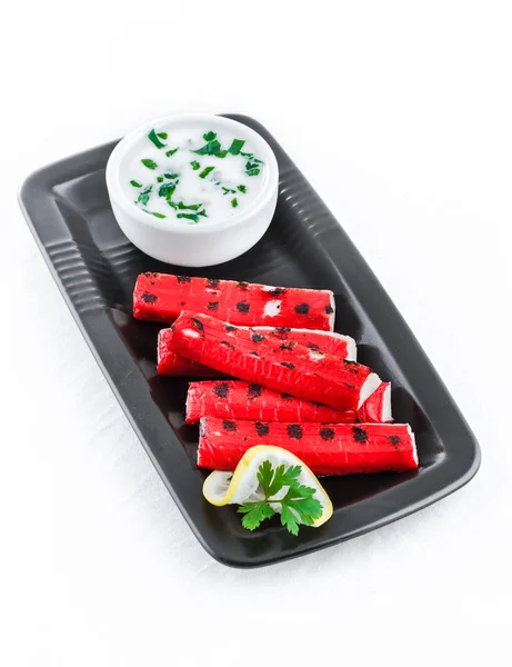 Grilled surimi sticks a form of kamaboko, a processed seafood made of white fish flesh with garlic dip — Stock Photo, Image