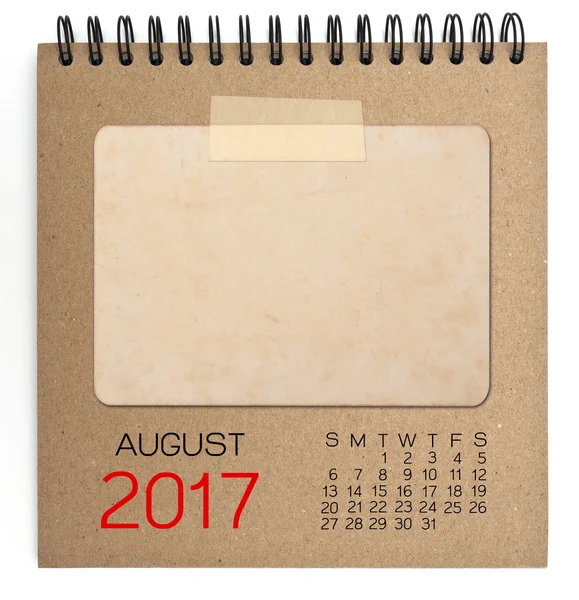 De kalender van 2017 op bruin notitieboekje met oude lege foto — Stockfoto