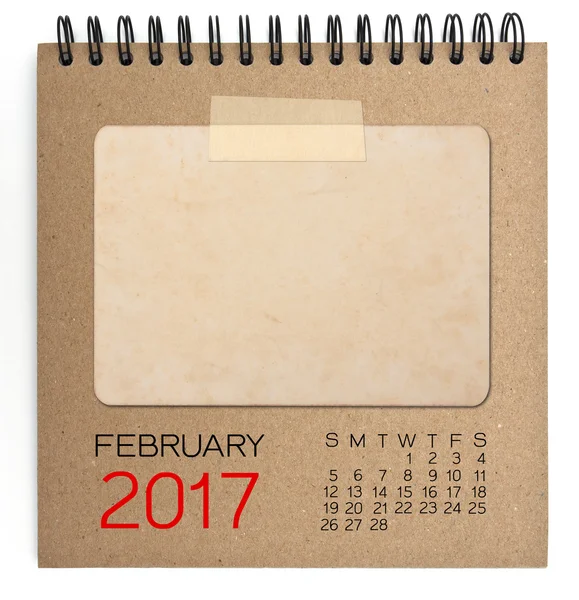 De kalender van 2017 op bruin notitieboekje met oude lege foto — Stockfoto