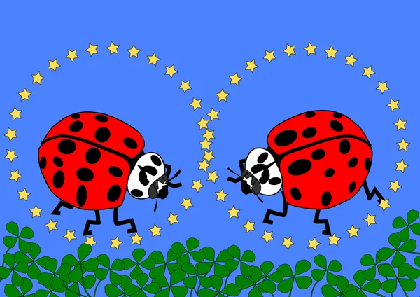 Zwei Marienkäfer mit gelben Sternen, blauem Hintergrund und vielen Shamrocks — Stockfoto