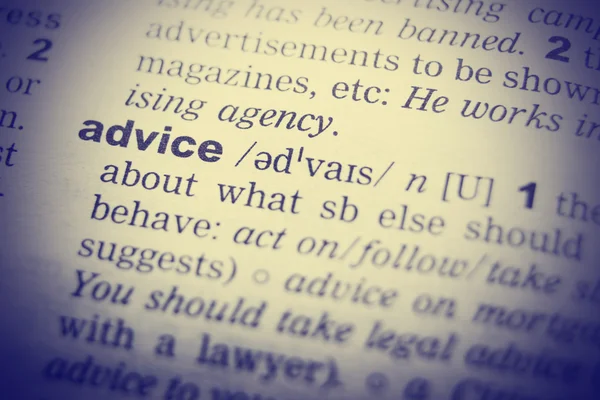 Close up of English dictionary page with word advice — Stock Photo, Image