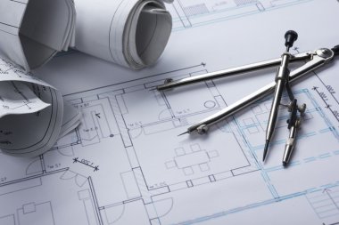 Mimar worplace üstten görünüm. Mimari Proje, planları, blueprint rulo ve bölücü pusula planları. İnşaat arka plan. Mühendislik araçları. Kopya alanı