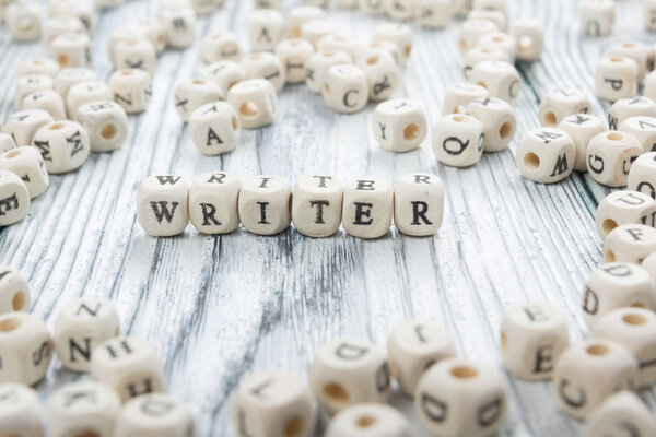 writer word written on wood block. wooden abc