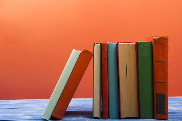 Stack of hardback books on wooden table. Back to school. Copy space for text — Stock Photo, Image