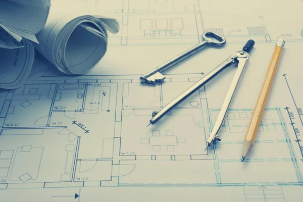 Architect worplace top view. Architectural project, blueprints, blueprint rolls and  divider compass, pencil on plans. Construction background. Engineering tools. Copy space — Stock Photo, Image