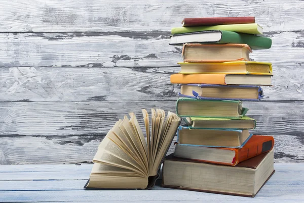 Open book, hardback books on wooden table. Back to school. Copy space for text — Stock Photo, Image