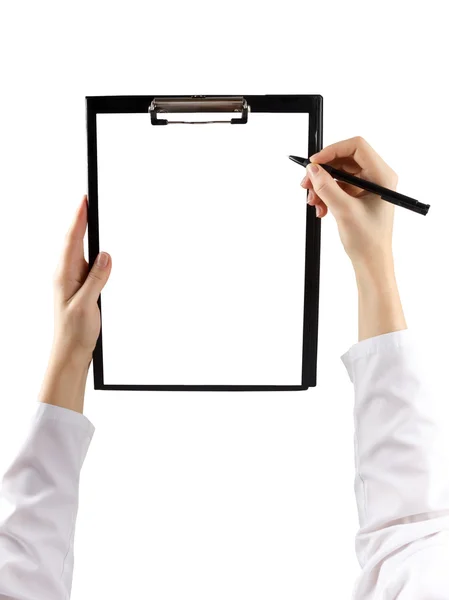 Female hand holding a pen and clipboard with blank paper (document, report) isolated on white background. Top view.