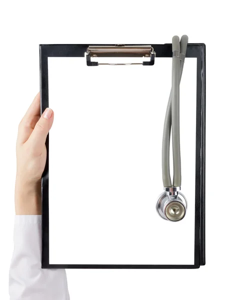 Female doctor's hand holding medical clipboard with blank sheet of paper and stethoscope isolated on white background. Concept of Healthcare And Medicine. Copy space. Royalty Free Stock Images