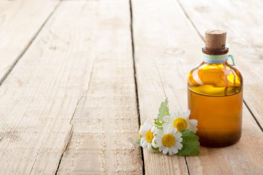 Fresh herb and bottle. Alternative medicine concept. Isolated on white background.