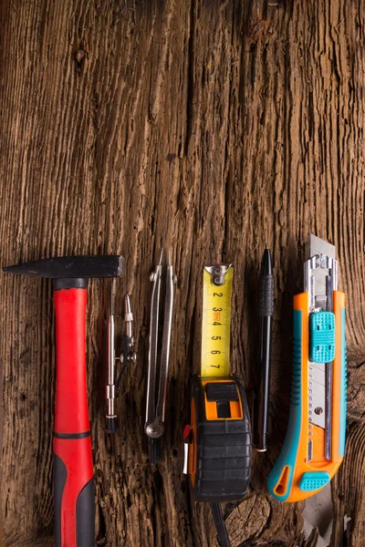 Architectural project, blueprints, blueprint rolls and divider compass, calipers on vintage wooden background. Construction concept. Engineering tools. Copy space — Stock Photo, Image