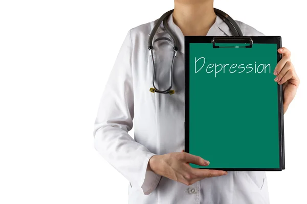 Депрессия - рука врача с медицинским планшетом и стетоскопом — стоковое фото