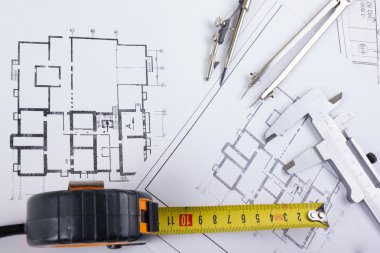 Mimari Proje, taslakları, blueprint rulo planları. Mühendislik araçları en baştan görüntüleyin. Uzay kopyalayın. İnşaat arka plan.