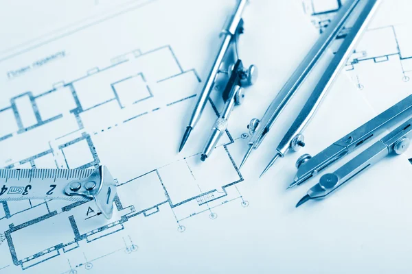 Architectural project, blueprints, blueprint rolls on plans. Engineering tools view from the top. Copy space. Construction background. — Stock Photo, Image