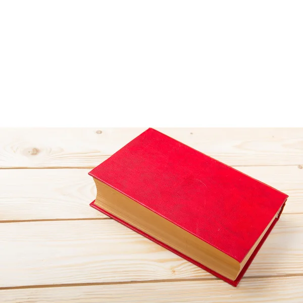 Libro rosso su tavolo di legno. Vista dall'alto. Torniamo a scuola. Copia spazio — Foto Stock