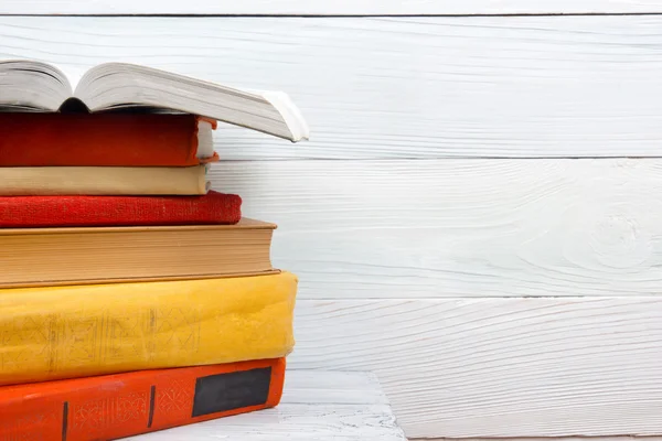 Open book, hardback books on wooden table. Back to school. Copy space — Stock Photo, Image