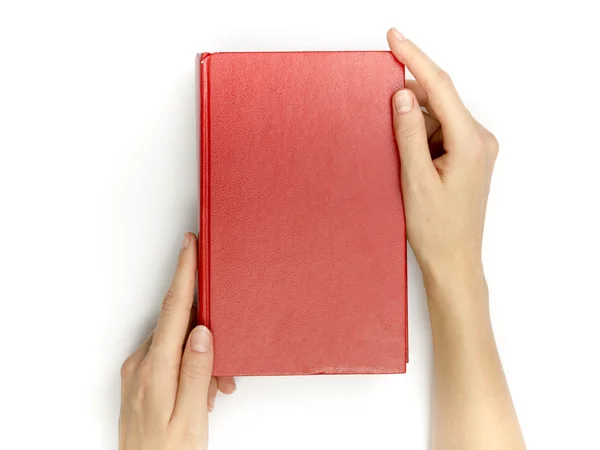 手拿空白红色的精装书，在白色背景上 — 图库照片