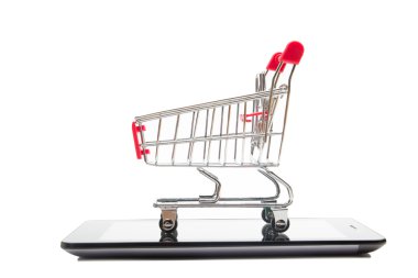 Online shopping concept - Empty Shopping Cart, laptop and tablet pc, smartphone isolated on white background. Copy space for text. clipart