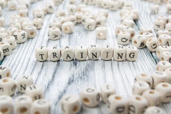 Training text on a wood blocks at wooden table — 스톡 사진