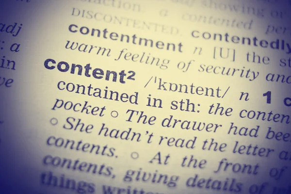Close up of English dictionary page with word Content — 图库照片