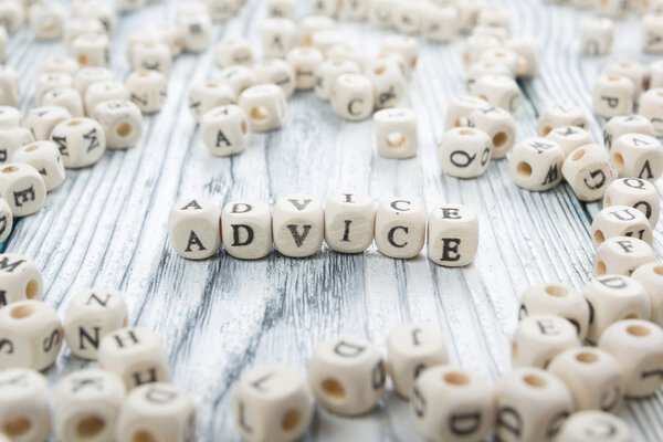 Advice word written on wood block. Wooden ABC