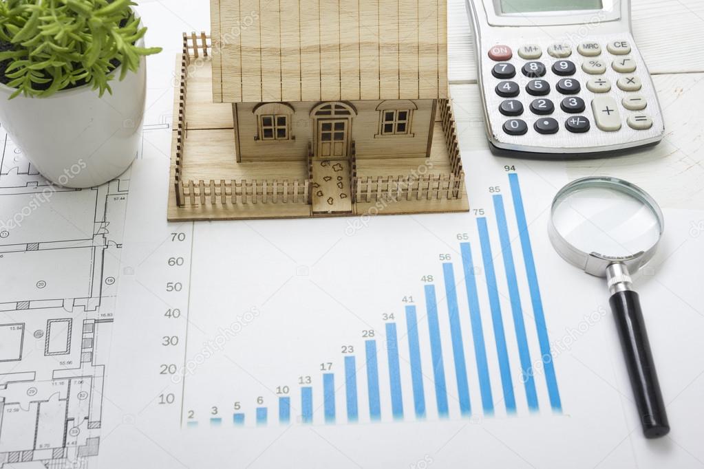 Model house, construction plan for house building, magnifying glass compass. calculator. Real Estate Concept. Top view.