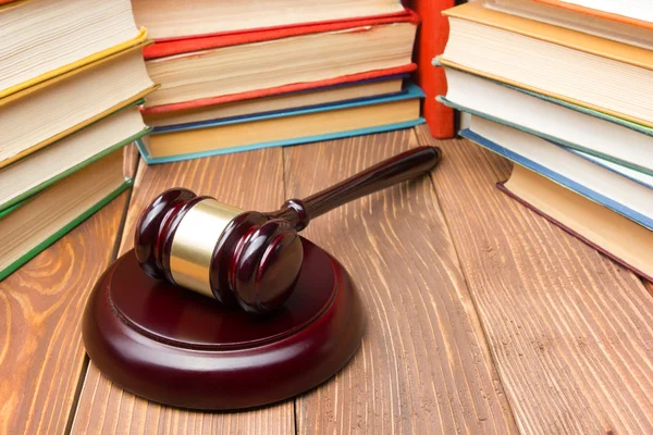 Law book with wooden judges gavel on table in a courtroom or law enforcement office. — Stock Photo, Image