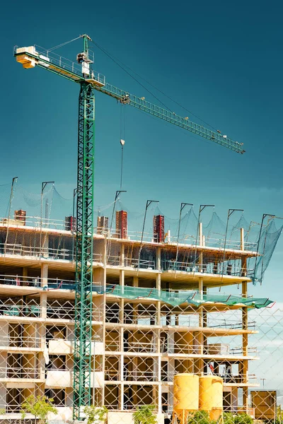 Construction and real estate industry. Sunset and foundation structure of houses.Cranes and building construction