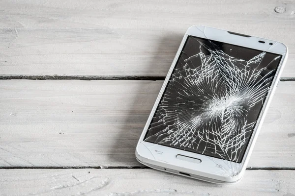 Smartphone display with broken glass — Stock Photo, Image