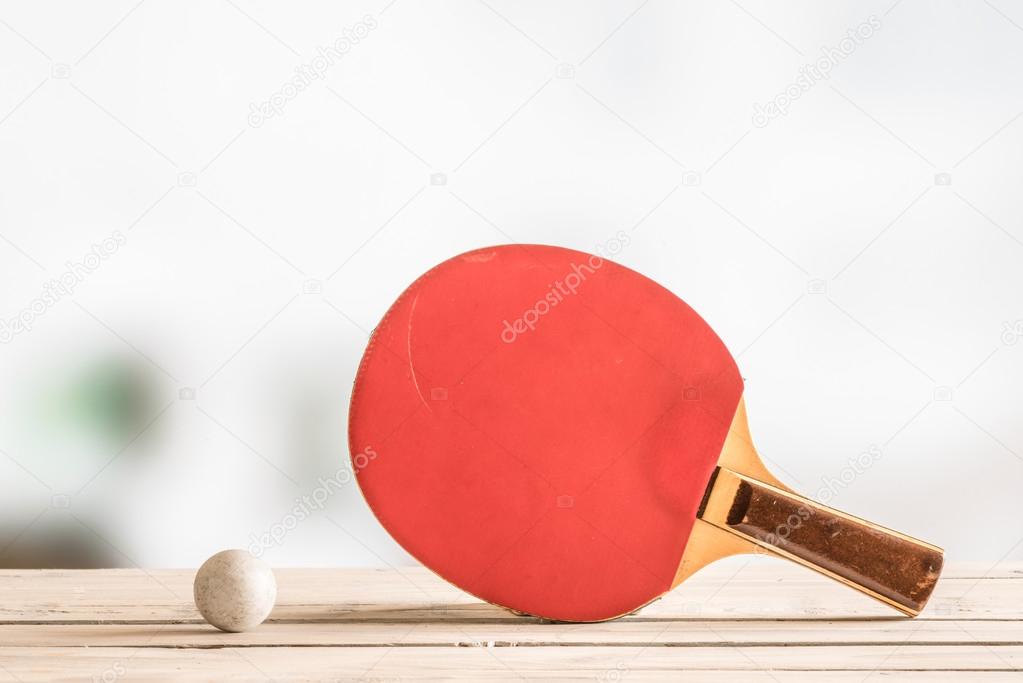 Table tennis bat with a ball