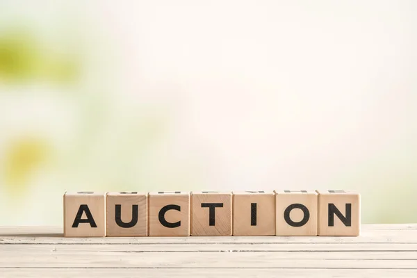 Auction sign on a vintage table — Stock Photo, Image