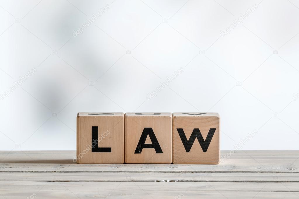 Law sign on a wooden desk