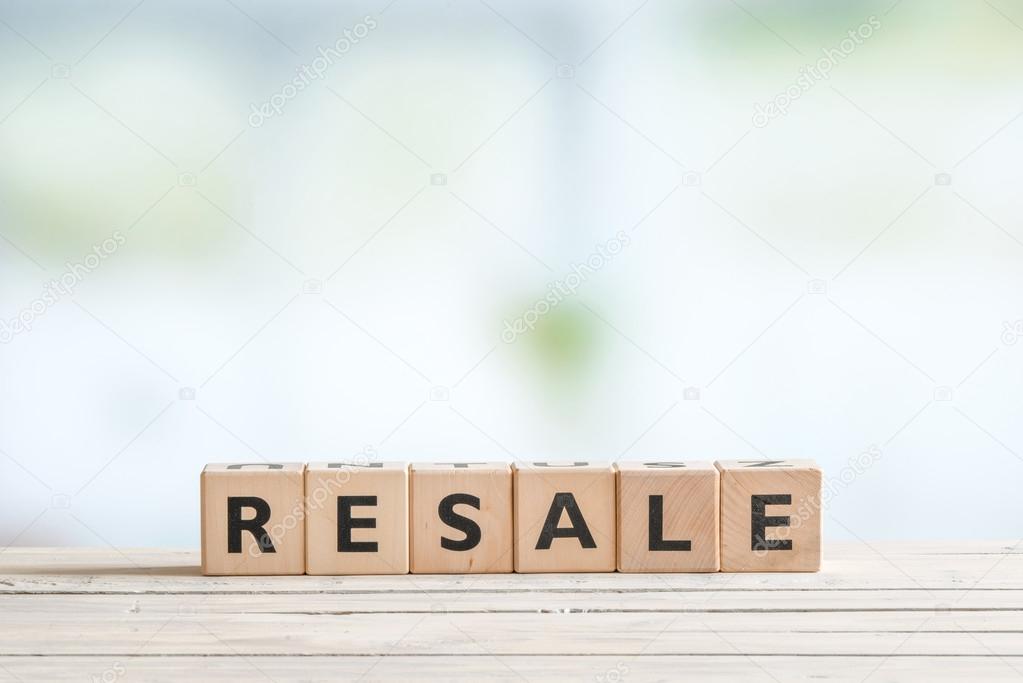 Resale sign on a wooden desk
