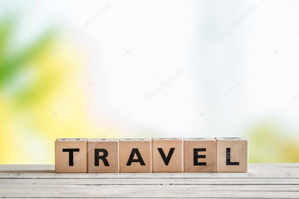 Travel sign on a wooden table