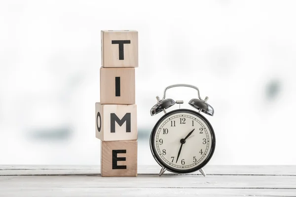 Time concept with a clock and a word — Stock Photo, Image