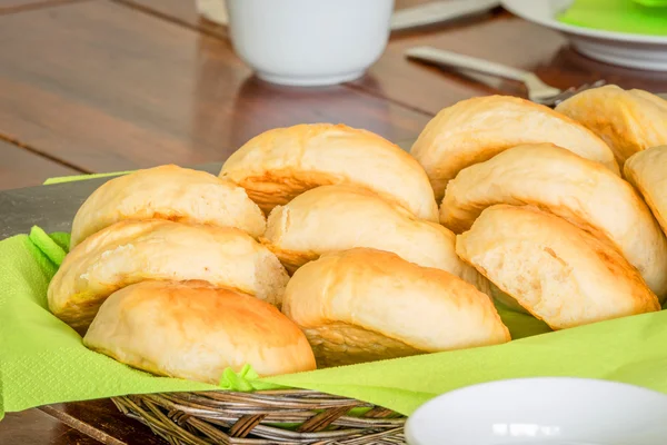 Buns in a basket on a table — Stock Photo, Image