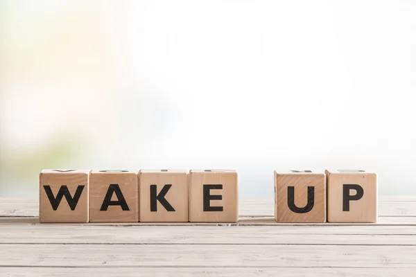 Wake up sign with wooden cubes — Stock Photo, Image