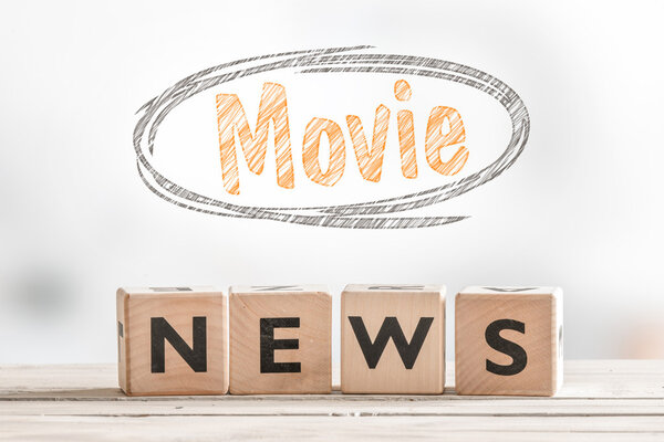 Movie news sign cubes on a table