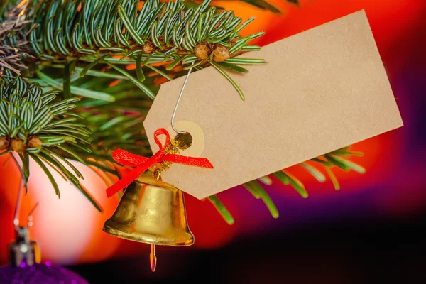 Christmas bell with a card — Stock Photo, Image
