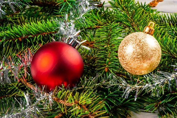 Christmas baubles on pine — Stock Photo, Image