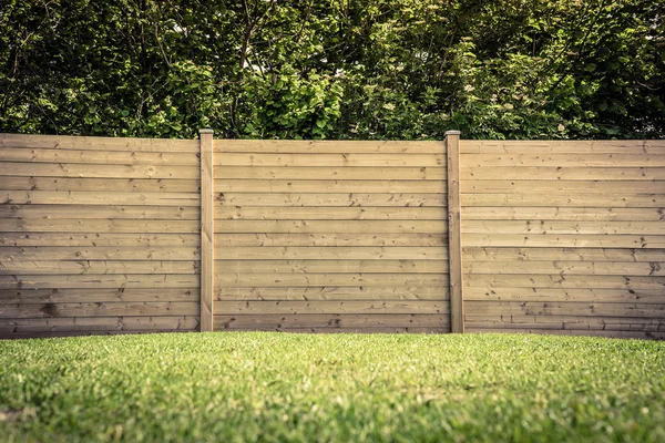 Fence on lawn — Stock Photo, Image