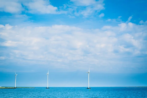 Windmills in the blue ocean — Stock Photo, Image