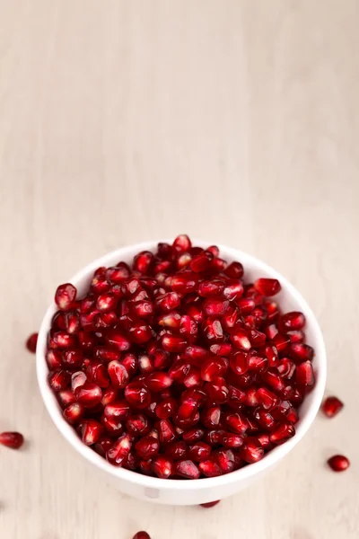 Pomegranate seeds on white — Stock Photo, Image