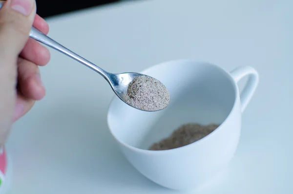 Instant coffee with spoon and coffee cup — Stock Photo, Image